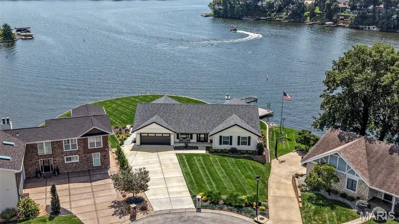 Spectacular aerial view showcasing the home’s incredible setting, expansive lake frontage and panoramic views of Lake Saint Louis. — 22 Harbor Point Court, Lake St. Louis, MO 63367