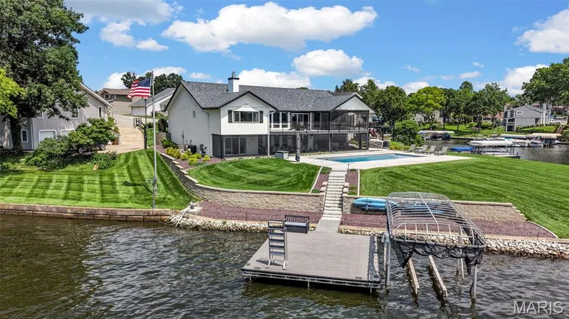 Private dock and a lift with cover (not shown) setup for a pontoon boat just waiting for your boat to pull right in. — 22 Harbor Point Court, Lake St. Louis, MO 63367
