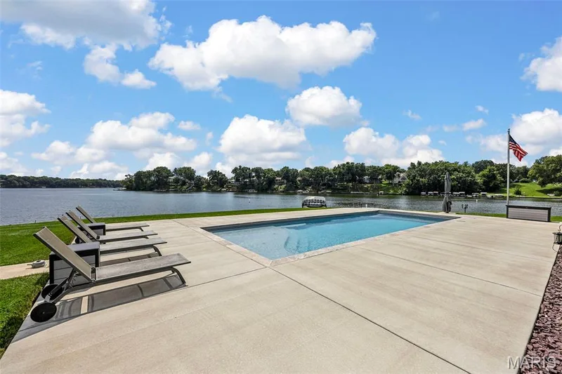 Poolside paradise with sweeping lake views—the perfect setting to relax, entertain and enjoy the Lake Saint Louis lifestyle. — 22 Harbor Point Court, Lake St. Louis, MO 63367