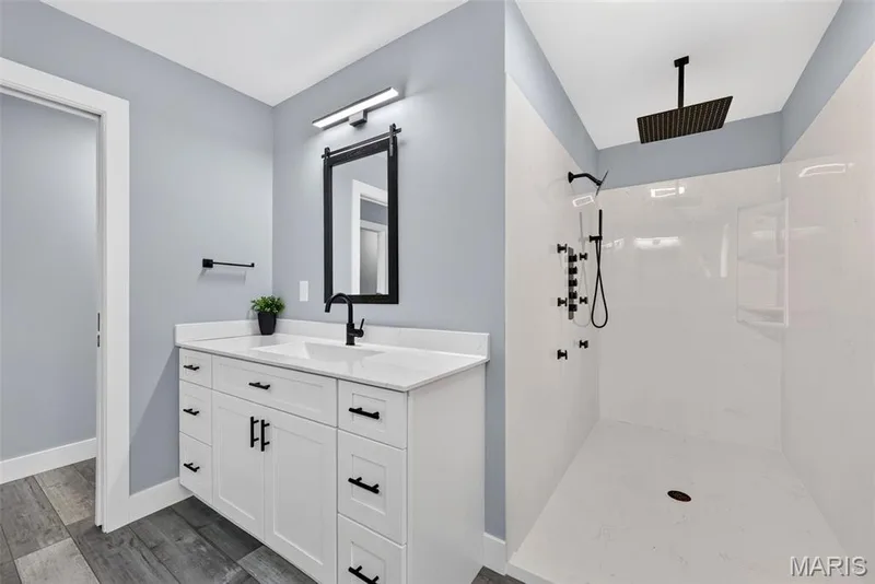 A spa-inspired retreat featuring an oversized walk-in shower with rainfall showerhead, body sprays and sleek contemporary finishes. — 22 Harbor Point Court, Lake St. Louis, MO 63367