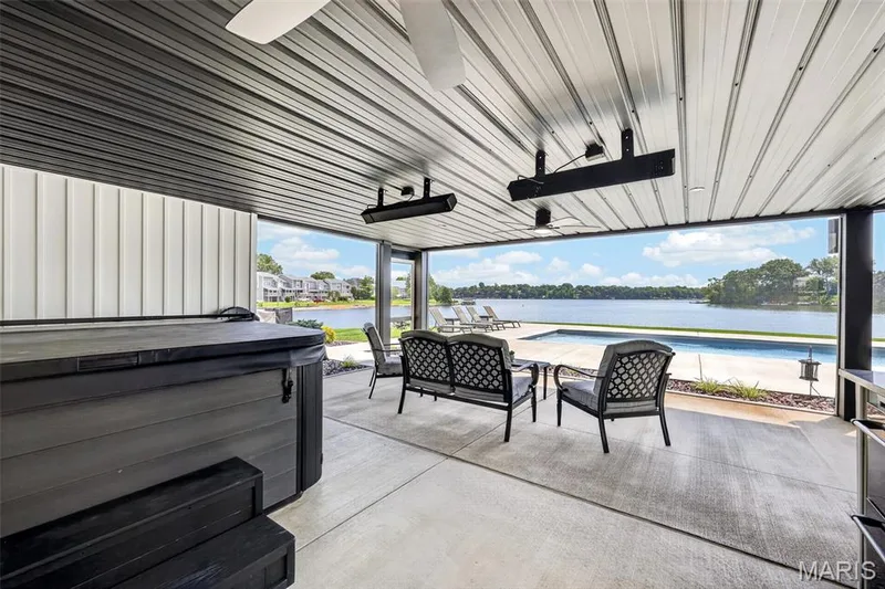 Your Own Lakeside Retreat! Covered Outdoor Living Area with Hot Tub, Overhead Heaters, Ceiling Fans and Screened area overlooking the Pool and Beautiful Lake Saint Louis! — 22 Harbor Point Court, Lake St. Louis, MO 63367