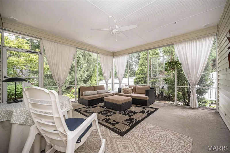 Screened porch with a white beadboard ceiling, ceiling fan, and light-colored siding — 1551 Country Bend Drive, St Charles, MO 63303
