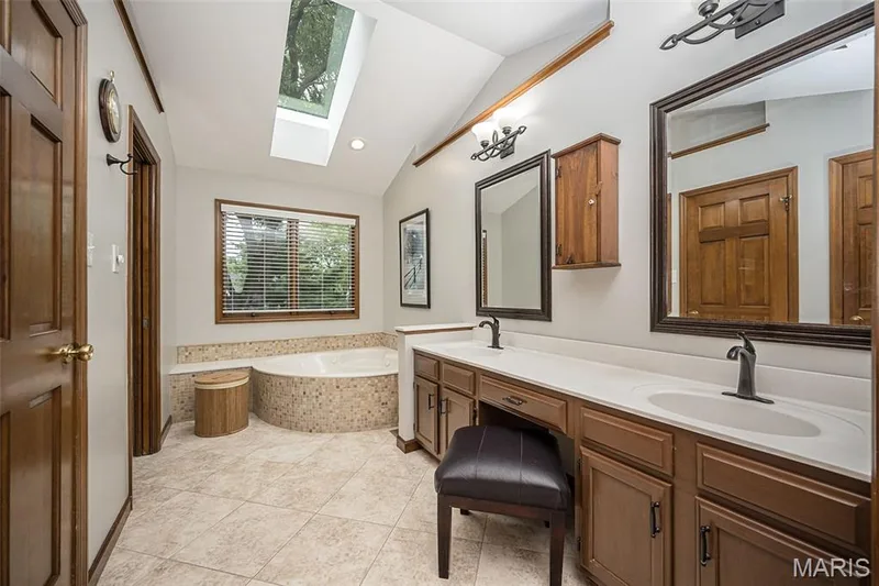 Dual vanity with under-mount sinks and integrated countertop — 1551 Country Bend Drive, St Charles, MO 63303