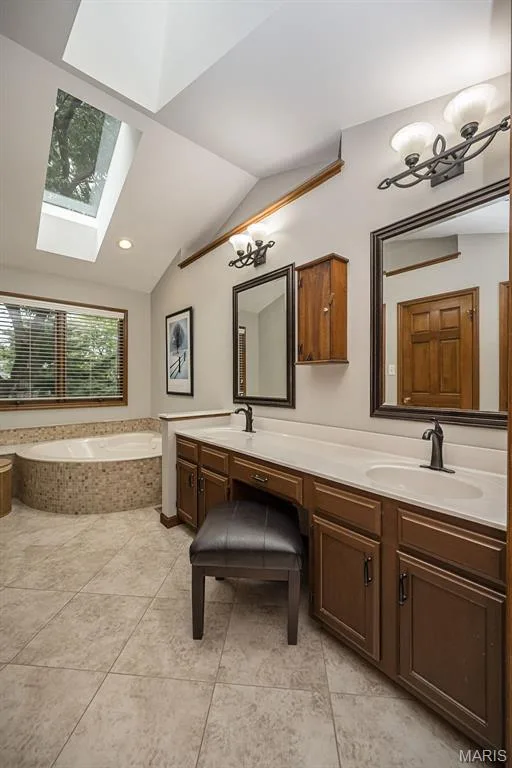 Vaulted ceiling with skylight and recessed lighting — 1551 Country Bend Drive, St Charles, MO 63303