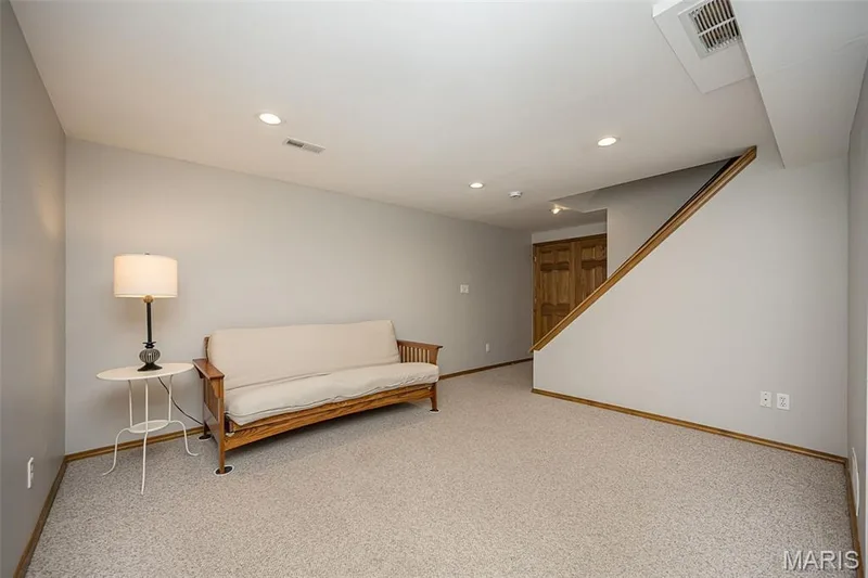 Recessed lighting, wood-finish trim, neutral wall color, and carpeted flooring — 1551 Country Bend Drive, St Charles, MO 63303