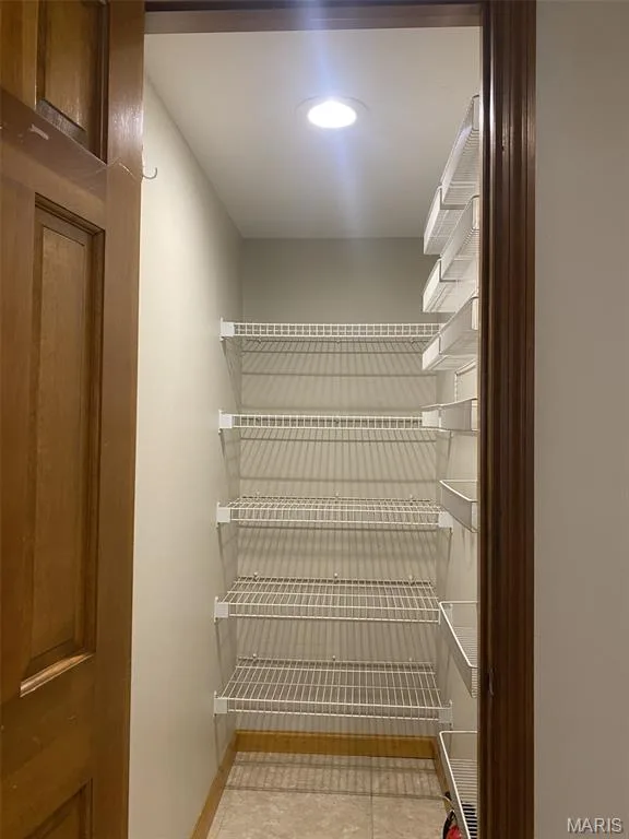 Recessed ceiling lighting, adjustable wire shelving, and tile flooring — 1551 Country Bend Drive, St Charles, MO 63303