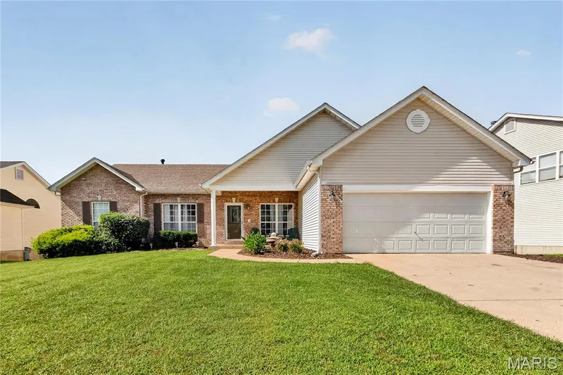 Brick and siding exterior with a pitched roof — 934 Annabrook Park Drive, O'Fallon, MO 63366