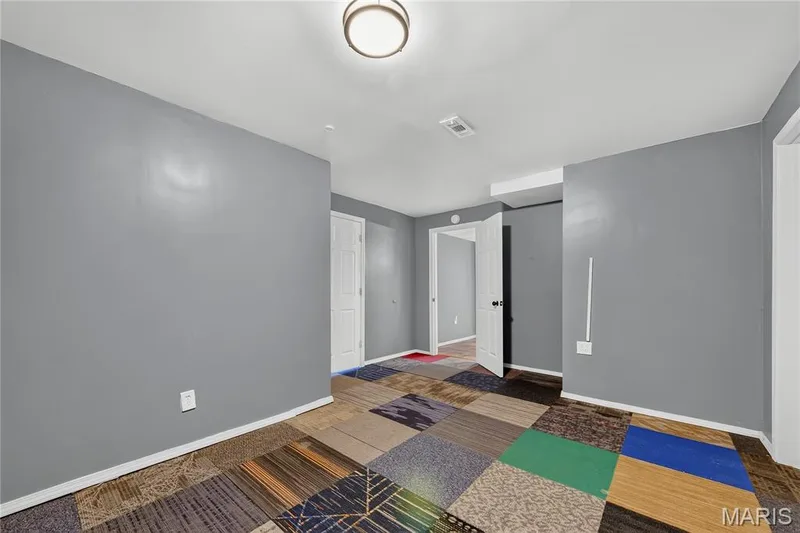 Recessed ceiling light, white trim, and a patterned floor covering — 934 Annabrook Park Drive, O'Fallon, MO 63366