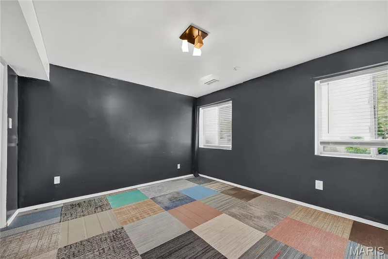Recessed ceiling lighting, two windows, and colorful square-patterned flooring — 934 Annabrook Park Drive, O'Fallon, MO 63366