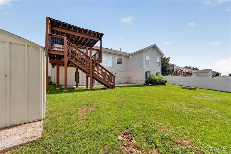 Two-story wood-finish deck with covered upper level and staircase — 934 Annabrook Park Drive, O'Fallon, MO 63366
