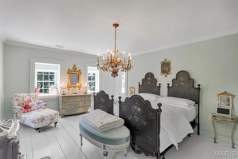 Light-toned wood-finish flooring, white trim, and a decorative chandelier — 2275 Highway F #LOT 1, Defiance, MO 63341