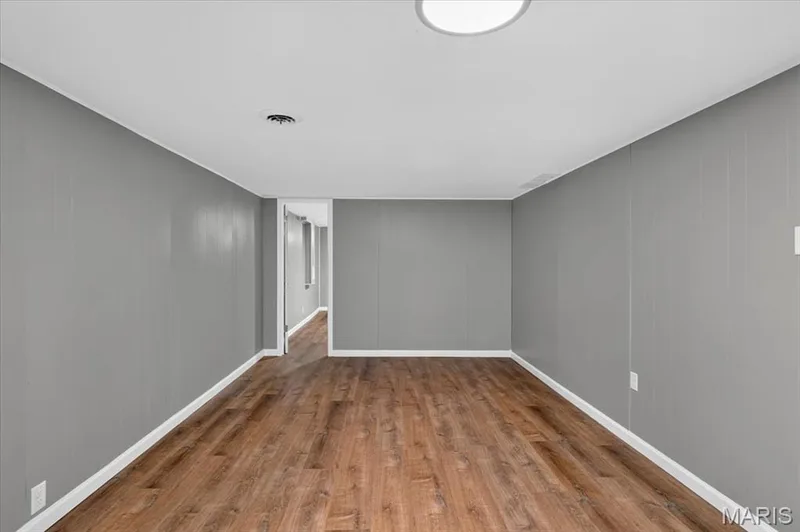 Rec room in finished lower level where you will also discover luxury vinyl plank flooring. — 2428 Golfway Drive, St Charles, MO 63301