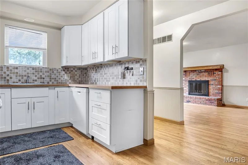 A view from the kitchen into the main level family room — 1401 Tamarack Drive, St Charles, MO 63301