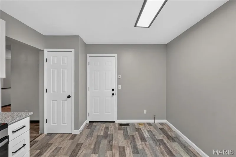 The door to your left is a pantry and the door to the right opens to the 2-c garage. — 1688 Knightwood Lane, O'Fallon, MO 63366
