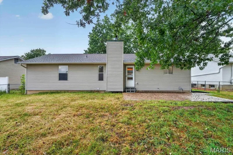 Fenced back yard and spacious patio. — 1688 Knightwood Lane, O'Fallon, MO 63366