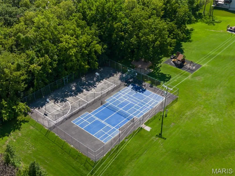 Community tennis, pickleball and basketball courts provide recreation close to home. — 11075 Village Drive, Foristell, MO 63348