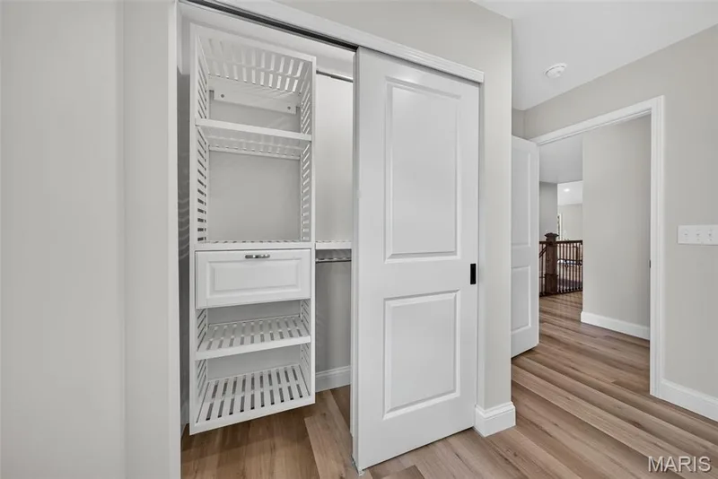 Upgraded wood closet systems provide attractive, organized storage. — 11075 Village Drive, Foristell, MO 63348