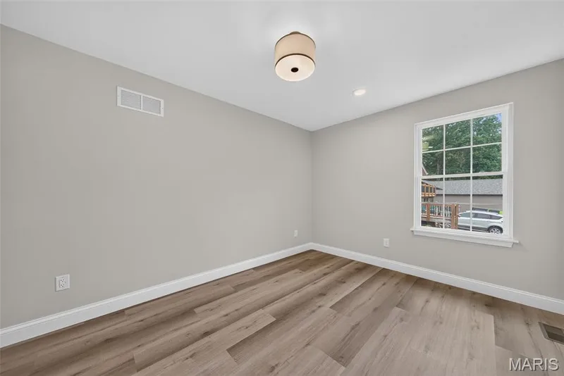 The third bedroom offers flexible space for guests or a home office. — 11075 Village Drive, Foristell, MO 63348