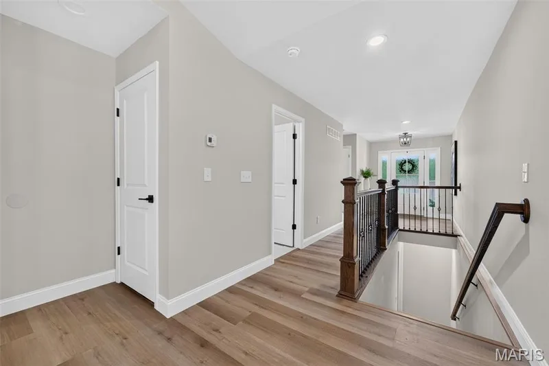 Interior stairs lead to the expansive unfinished lower level. — 11075 Village Drive, Foristell, MO 63348
