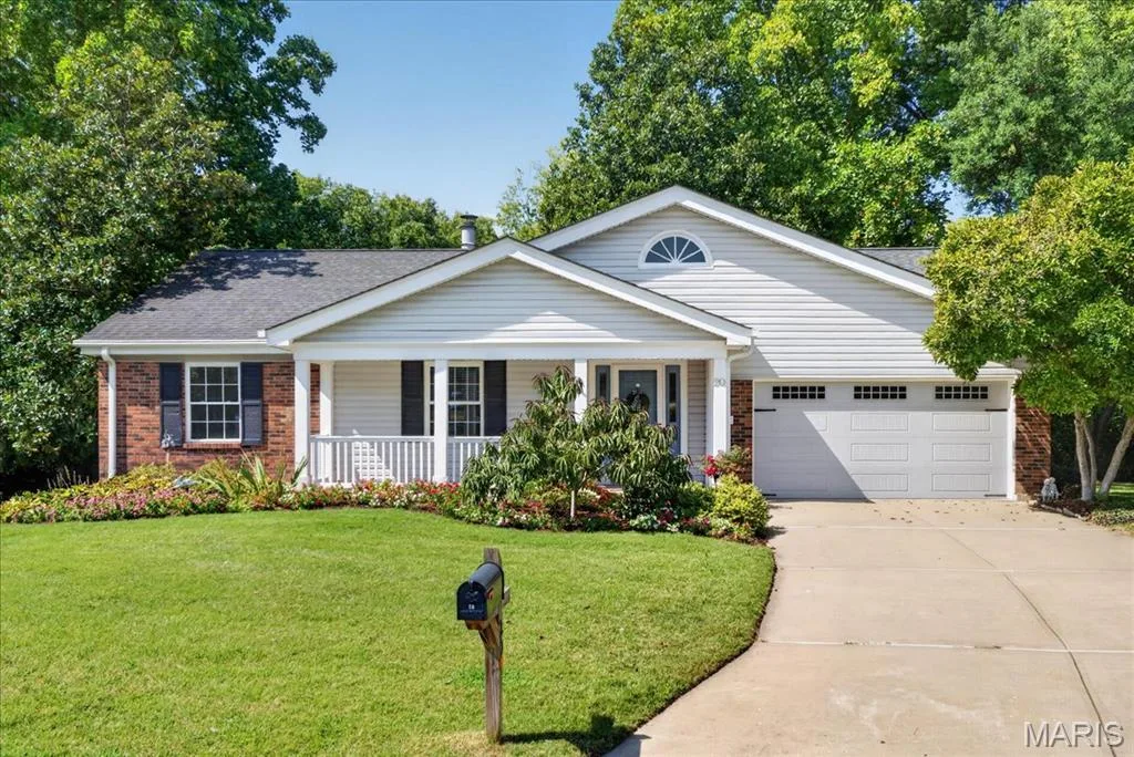 Brick and siding exterior with a covered front porch — 20 Ardennais Road, St Peters, MO 63376