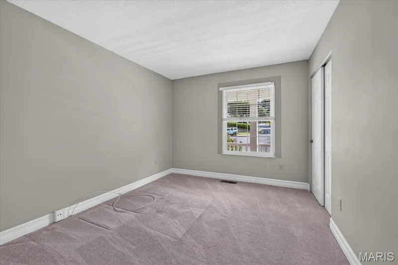 Bedroom 2- Wall-to-wall carpeting and neutral wall tones — 20 Ardennais Road, St Peters, MO 63376