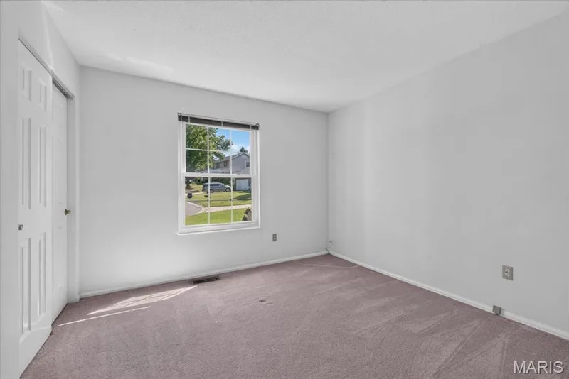 Bedroom 3- Carpeted flooring, white walls, and a window with blinds — 20 Ardennais Road, St Peters, MO 63376