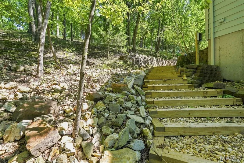 Stairs at the side of the home leading to the back — 3311 Pine Cliff Road, Wildwood, MO 63038