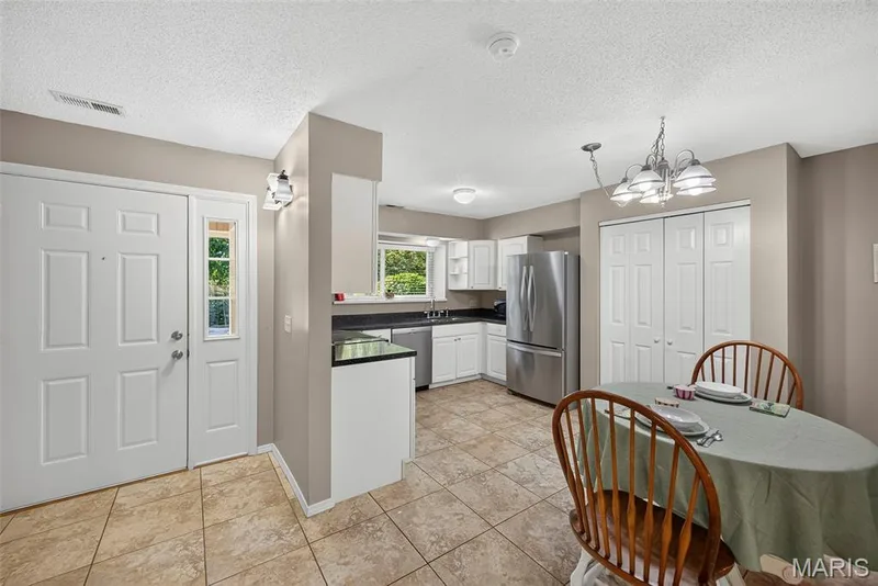 Entrance connecting kitchen and dinning area — 1 Rue De Paix #6, Lake St. Louis, MO 63367
