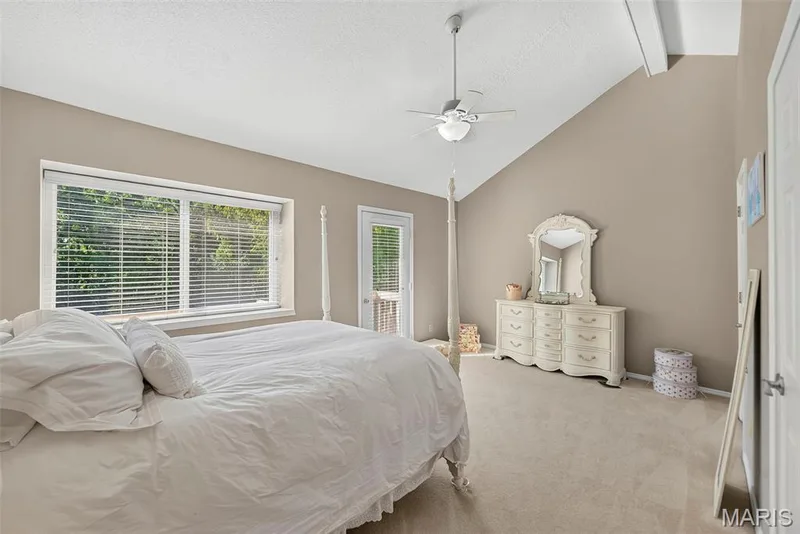 Primary bedroom with window shelf, and outdoor 7x4 balcony — 1 Rue De Paix #6, Lake St. Louis, MO 63367