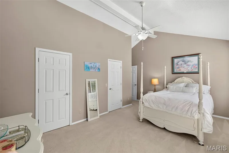 Primary bedroom with double closets and vaulted ceiling — 1 Rue De Paix #6, Lake St. Louis, MO 63367
