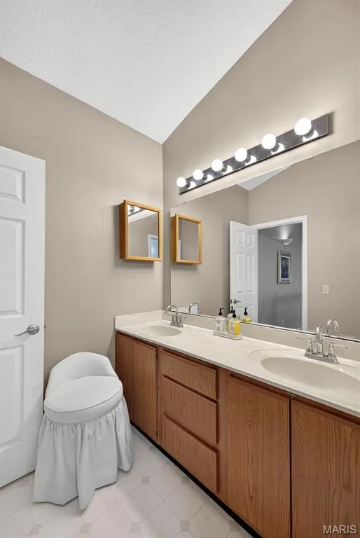 Double sink bathroom with storage — 1 Rue De Paix #6, Lake St. Louis, MO 63367