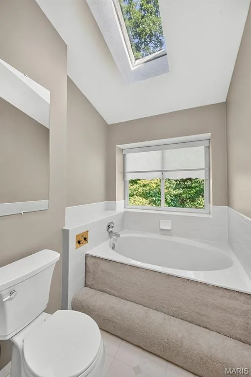 Soaking tub with skylight for natural light — 1 Rue De Paix #6, Lake St. Louis, MO 63367