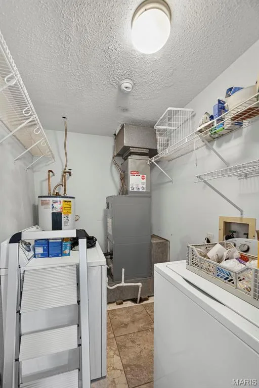 Laundry room featuring wired shelves — 1 Rue De Paix #6, Lake St. Louis, MO 63367