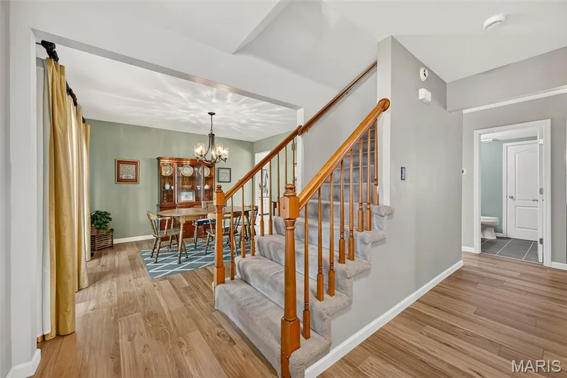 Wood-finish flooring throughout the main level — 10 Docs Ct., St Charles, MO 63303