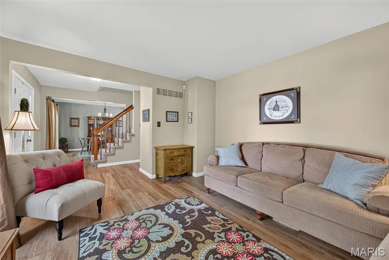 Wood-finish flooring throughout the main living area — 10 Docs Ct., St Charles, MO 63303