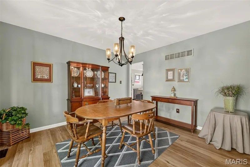 Warm wood-finish flooring with light-toned walls — 10 Docs Ct., St Charles, MO 63303