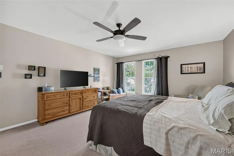 Dual windows, ceiling fan, and carpeted flooring — 10 Docs Ct., St Charles, MO 63303