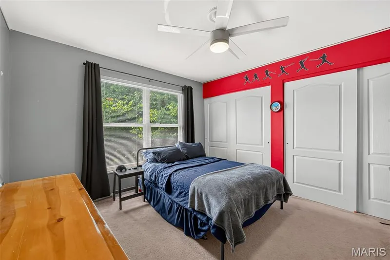 Recessed window with white blinds, neutral wall-to-wall carpeting, and a ceiling fan with integrated lighting — 10 Docs Ct., St Charles, MO 63303