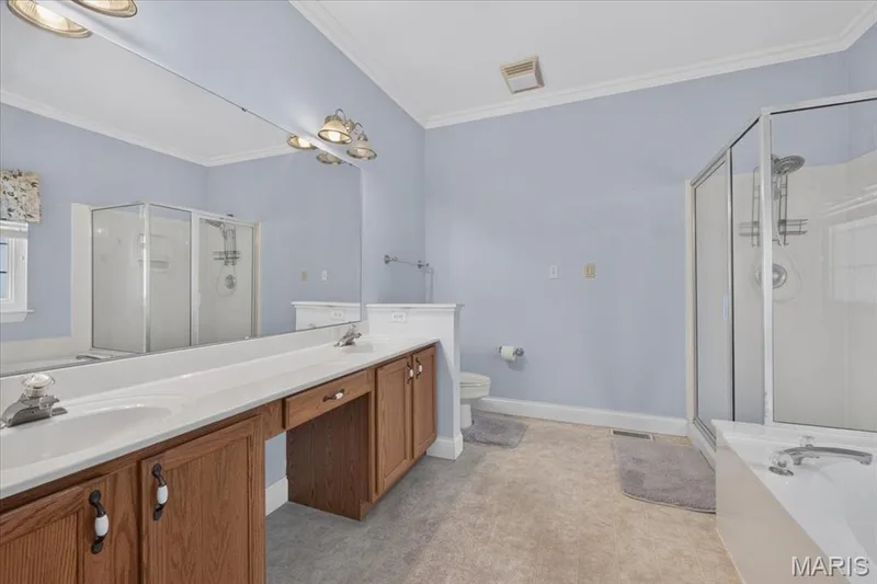 Primary bathroom with double vanity — 2418 Golden Bear Way #711A, Wentzville, MO 63385