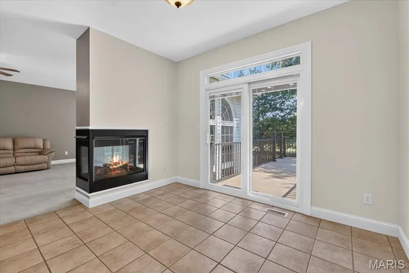 Sliding doors in the eat in kitchen that lead to the composite deck and fairway #9 — 2418 Golden Bear Way #711A, Wentzville, MO 63385