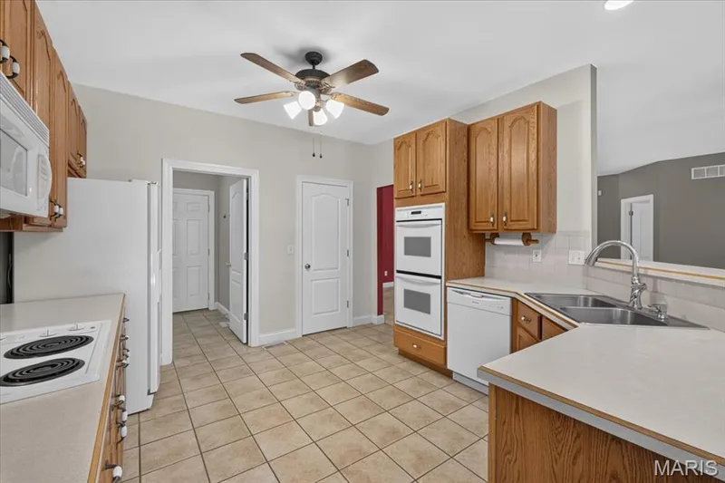 Kitchen with double oven and a brand new dishwasher — 2418 Golden Bear Way #711A, Wentzville, MO 63385