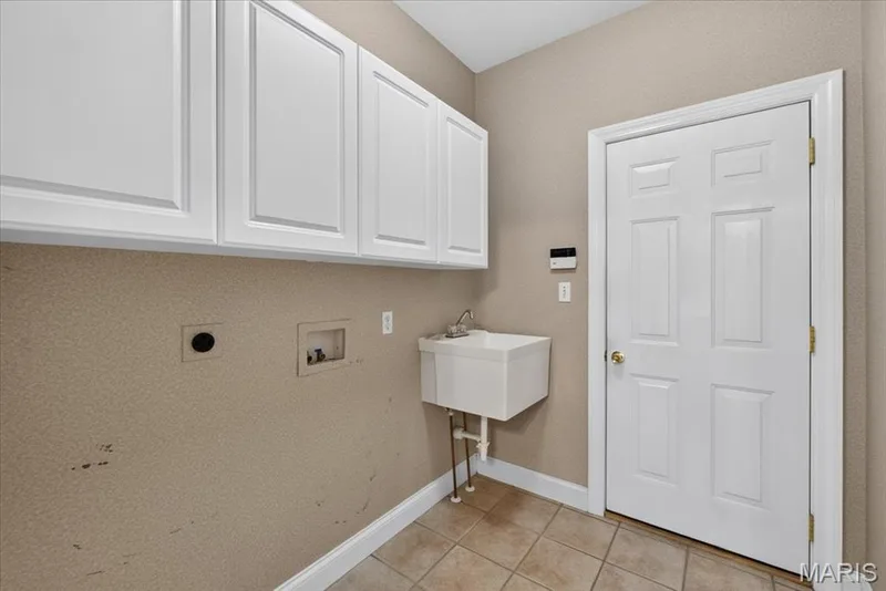 Main floor laundry room off the garage — 2418 Golden Bear Way #711A, Wentzville, MO 63385