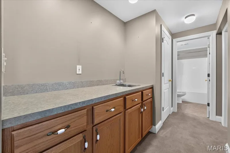 Wet bar area in lower level — 2418 Golden Bear Way #711A, Wentzville, MO 63385