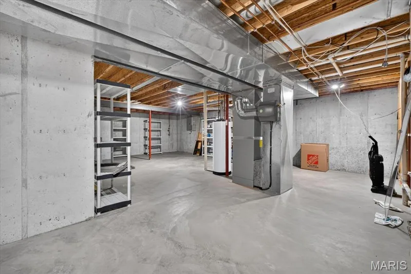 Unfinished area in lower level with lots of storage — 2418 Golden Bear Way #711A, Wentzville, MO 63385