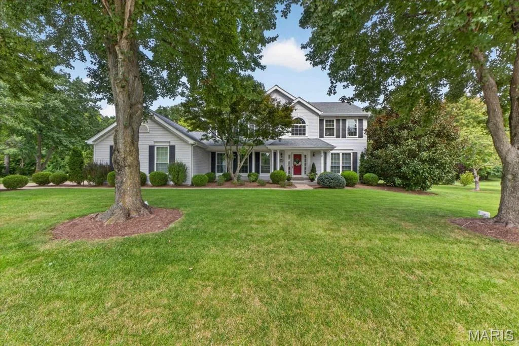 Two-story residence with a light-colored exterior and black window shutters — 5856 Canterfield Court, Weldon Spring, MO 63304