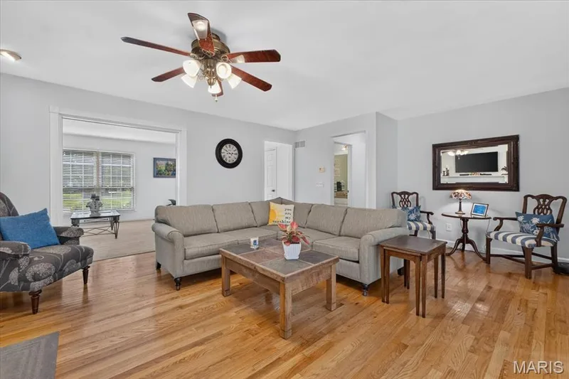 Hardwood flooring throughout, recessed lighting, and an overhead ceiling fan with integrated lighting — 5856 Canterfield Court, Weldon Spring, MO 63304