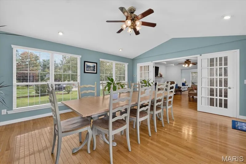 Dining area with hardwood flooring, vaulted ceiling, recessed lighting, and a ceiling fan — 5856 Canterfield Court, Weldon Spring, MO 63304