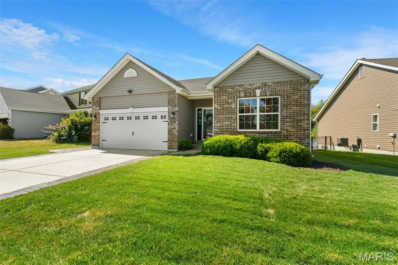 Gorgeous lawn kept up with pride! Come tour 213 Charlestowne Place SOON. — 213 Charlestowne Place Drive, St Charles, MO 63301
