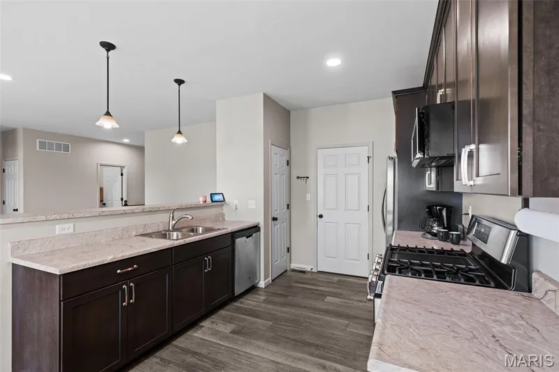 Pantry and door to laundry and garage. — 213 Charlestowne Place Drive, St Charles, MO 63301
