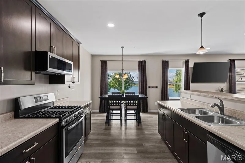 The open floor plan is great for entertaining — 213 Charlestowne Place Drive, St Charles, MO 63301